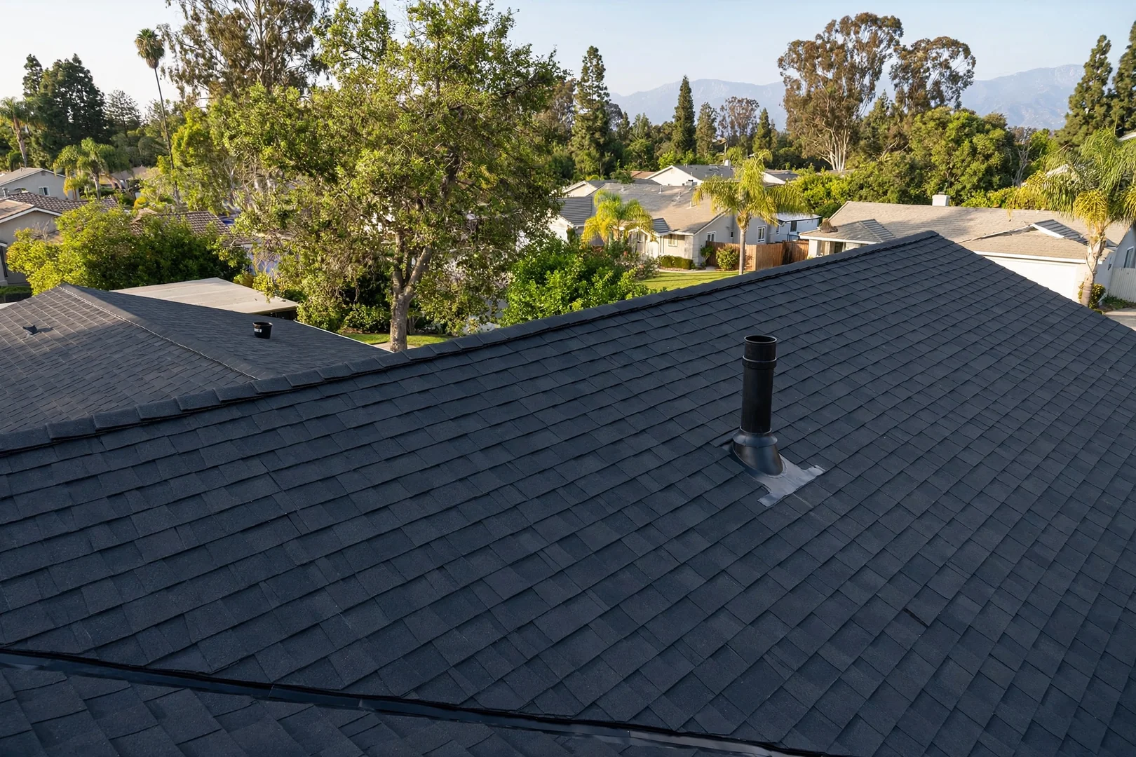 Finished roof plane with uniform shingle color after repairs identified by inspection